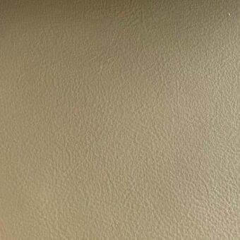 Rugiano indoor leather swatch, tan-brown Nu 181, displays a matte finish with a consistent, fine-grained, pebbled texture and diffused lighting.
